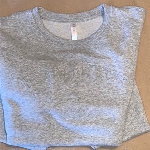 Fabletics “Never Settle” crew neck size large.